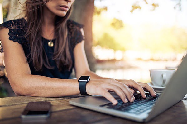 intesol-woman-studying-on-laptop